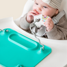 Baby in highchair with Busy Baby mat silicone mat
