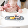 Baby at highchair with Pewter Busy Baby Mini Mat silicone mat with orange slices