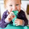 Baby chewing on bottom of Spearmint Busy Baby 2-in-1 Teether & Training Spoon