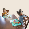 Two children do a painting craft on Busy Baby Toddler Mat