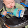 Baby in stroller dropping bottle attached to Blue Busy Baby Bottle Bungee
