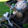 Busy Baby pewter teething spoon and toy bungee on stroller