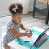 Child tracing on Busy Baby Toddler Mat & Learning Stand
